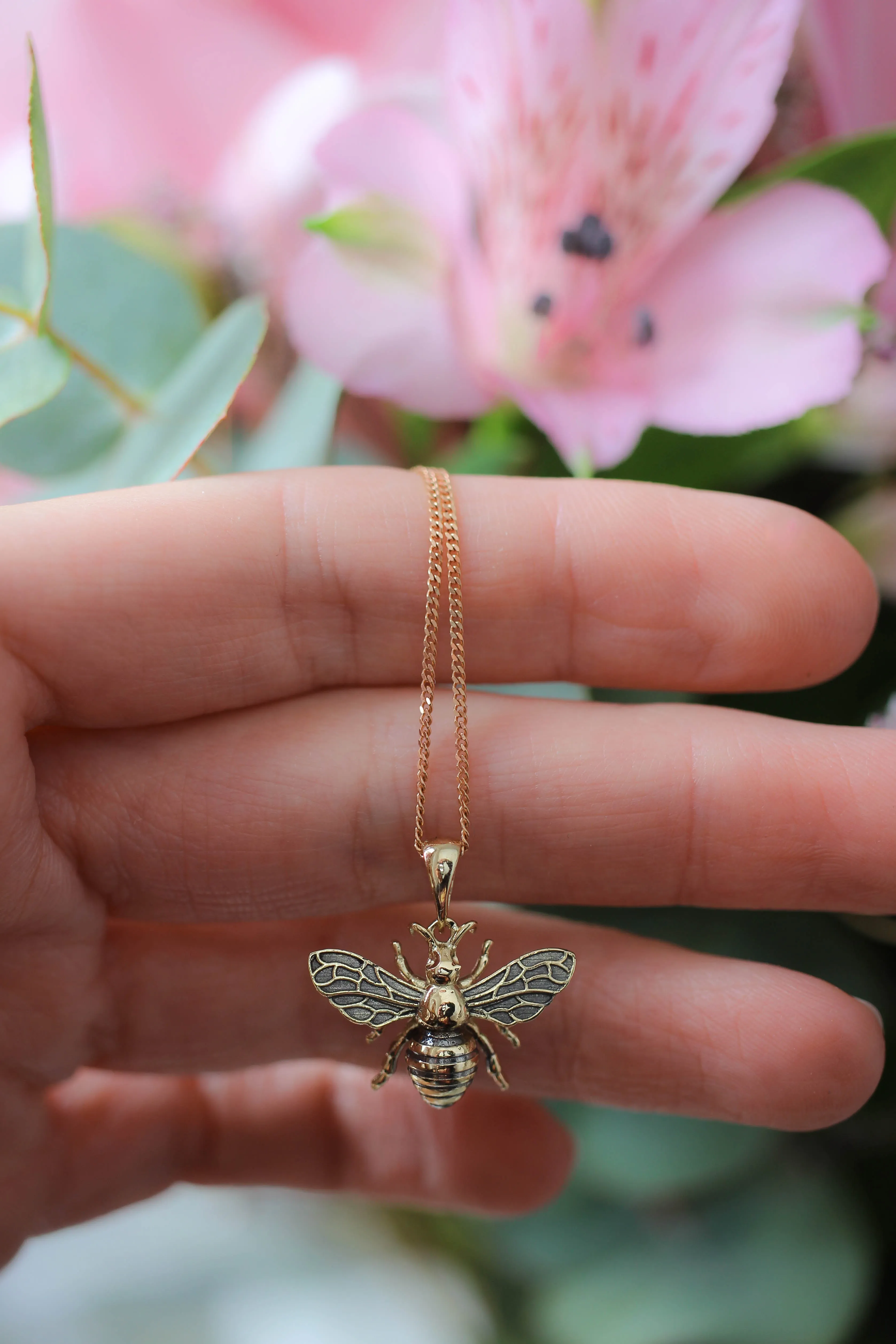 Gold bee pendant